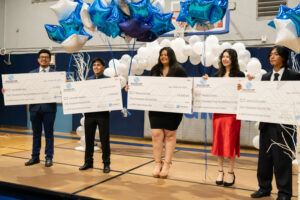 2024 Youth of the Year Finalists holding their checks